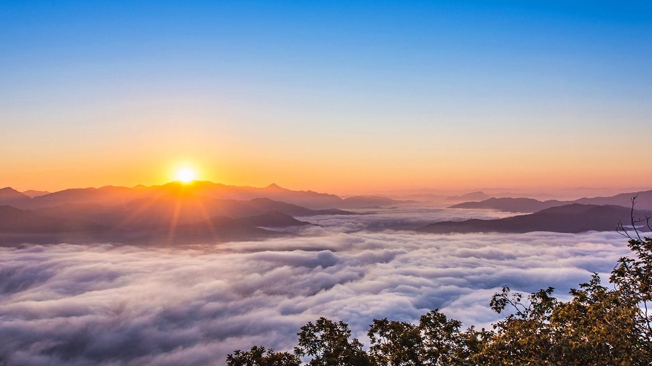 Sun over hills with link to non dual meditation